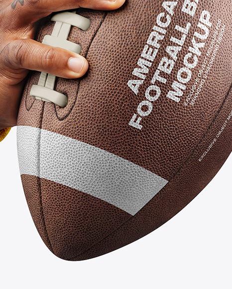 American Football Ball in a Hand Mockup
