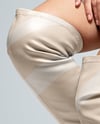 Pair of Over-The-Knee Boots on Women's Legs on Stool Mockup