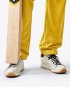 Man Wearing a Full Cricket Kit with Bat Mockup