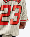 Afro-American Baseball Player Wearing a Jersey and Cap Holding a Bat Mockup