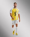 Soccer Player Wearing Raglan Jersey and Shorts Mockup