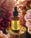 Amber Dropper Bottle with Oil Tincture Surrounded by Flowers Mockup