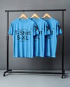 Three T-Shirts on a Wooden Hanger Against a Plain Background Mockup