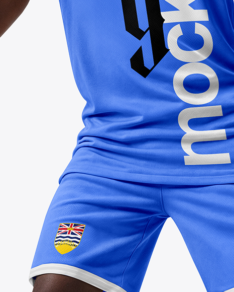 Basketball Player Wearing a Crew Neck Jersey and Shorts Holding a Basketball Mockup