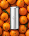 8.5oz Slim Drink Can on a Stack of Oranges Mockup