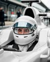 Man Wearing Racing Kit in Formula 1 Car Mockup