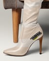 Pair of Over-The-Knee Boots on Women's Legs on Sofa Mockup