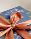 X-mas Gift Box with Bow and Decorations on Background Mockup