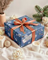 X-mas Gift Box with Bow and Decorations on Background Mockup