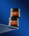 Two Amber Cosmetic Jars on the Glass Mockup
