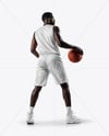 Basketball Player Wearing Jersey and Shorts with Basketball Mockup