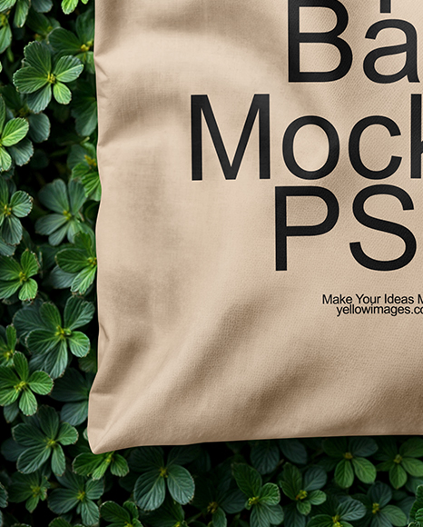 Tote Bag on a Green Leafy Background Mockup