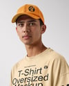 Young Man Wearing Oversized T-Shirt and Cap Mockup