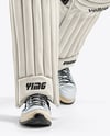 Man Wearing a Full Cricket Kit with Bat Mockup