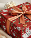 X-mas Gift Box with Bow and Decorations on Background Mockup