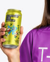 Woman Wearing a T-shirt Holding 16oz Drink Can Mockup