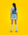 Female Soccer Player Wearing Jersey and Shorts Mockup