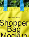 Tote Bag on a Green Leafy Background Mockup