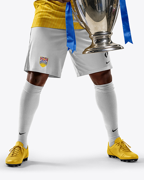 Soccer Player Wearing Jersey and Shorts Holds Cup Mockup