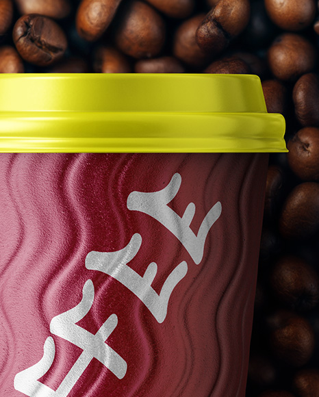 9oz Paper Cup on a Stack of Coffee Beans Mockup
