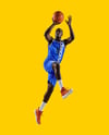Basketball Player Wearing Jersey and Shorts Holding a Basketball Mockup