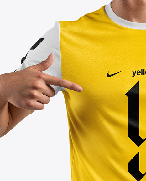 Man Wearing Soccer Jersey and Shorts Mockup