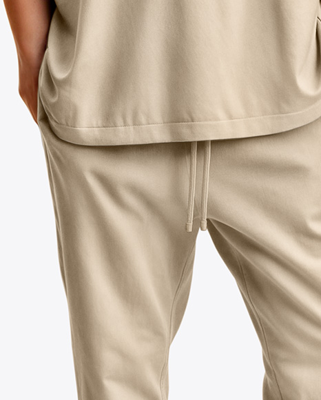 Man Wearing an Oversize T-shirt and Sweatpants Mockup
