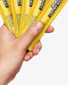 Five Sachets in a Hand Mockup