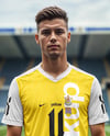 Soccer Player Wearing a Jersey and Shorts at the Stadium Mockup