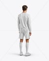 Man Wearing Long Sleeve Soccer Jersey and Shorts Mockup