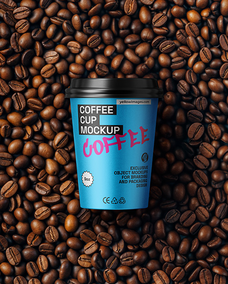 9oz Paper Cup on a Stack of Coffee Beans Mockup