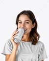 Woman Wearing a T-shirt Holding Drink Can Mockup