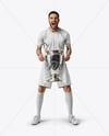 Man Wearing Soccer Jersey and Shorts Holds Cup Mockup