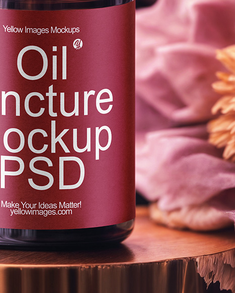 Amber Dropper Bottle with Oil Tincture Surrounded by Flowers Mockup