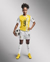 A Black Woman Wearing a Full Soccer Kit with a Ball Mockup