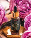 Amber Dropper Bottle with Oil Tincture Surrounded by Flowers Mockup