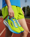 Pair of Running Shoes in Woman's Hand Mockup