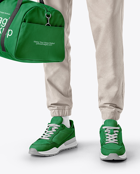 Man Wearing T-Shirt and Sweatpants Holding Duffle Bag Mockup