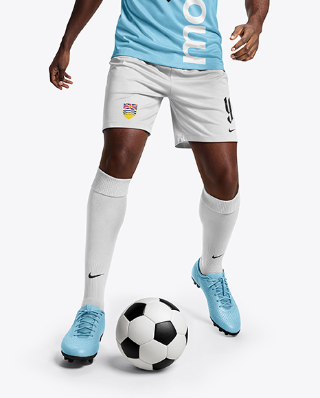 Soccer Player Wearing Raglan Jersey and Shorts Mockup