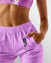 Woman Wearing Sports Bra and Sweatpants Mockup