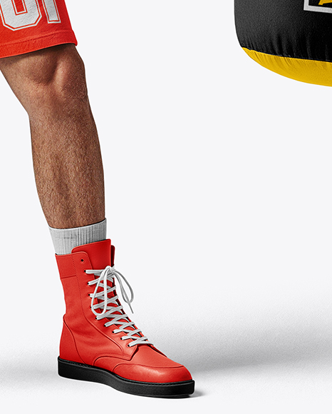 Man Wearing Boxing Sleeveless Hoodie and Shorts with Punching Bag Mockup