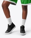 Female Basketball Player Wearing Jersey and Shorts Mockup