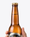 Amber Glass Beer Bottle in a Hand Mockup