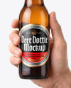 Amber Glass Beer Bottle in a Hand Mockup