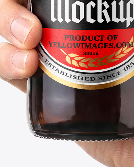 Amber Glass Beer Bottle in a Hand Mockup