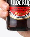 Amber Glass Beer Bottle in a Hand Mockup