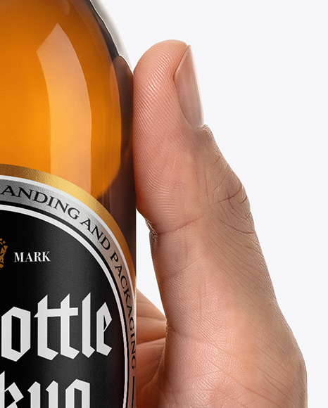 Amber Glass Beer Bottle in a Hand Mockup