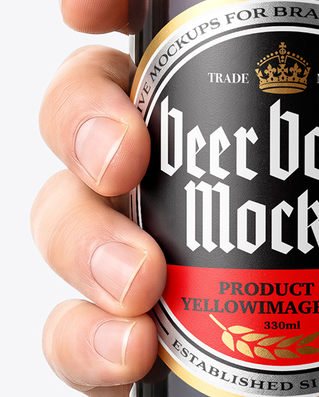 Amber Glass Beer Bottle in a Hand Mockup