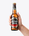 Amber Glass Beer Bottle in a Hand Mockup