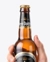 Amber Glass Beer Bottle in a Hand Mockup